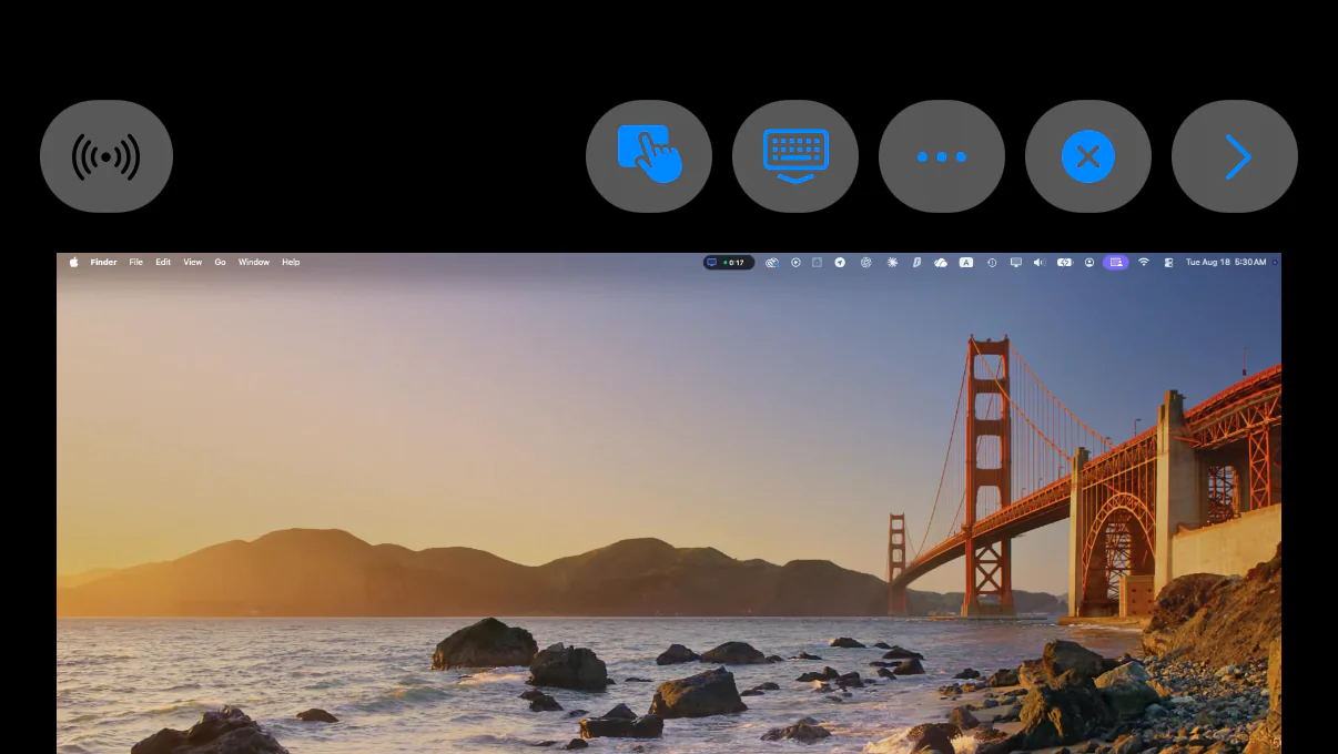 The TouchNow session screen on iPhone: the toolbar across the top holds radio, control mode, keyboard, more options, disconnect and collapse; the Mac’s desktop is below it.